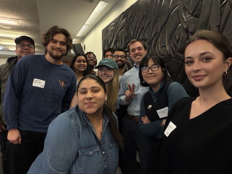 A group photo with Baruch College alumni and students.